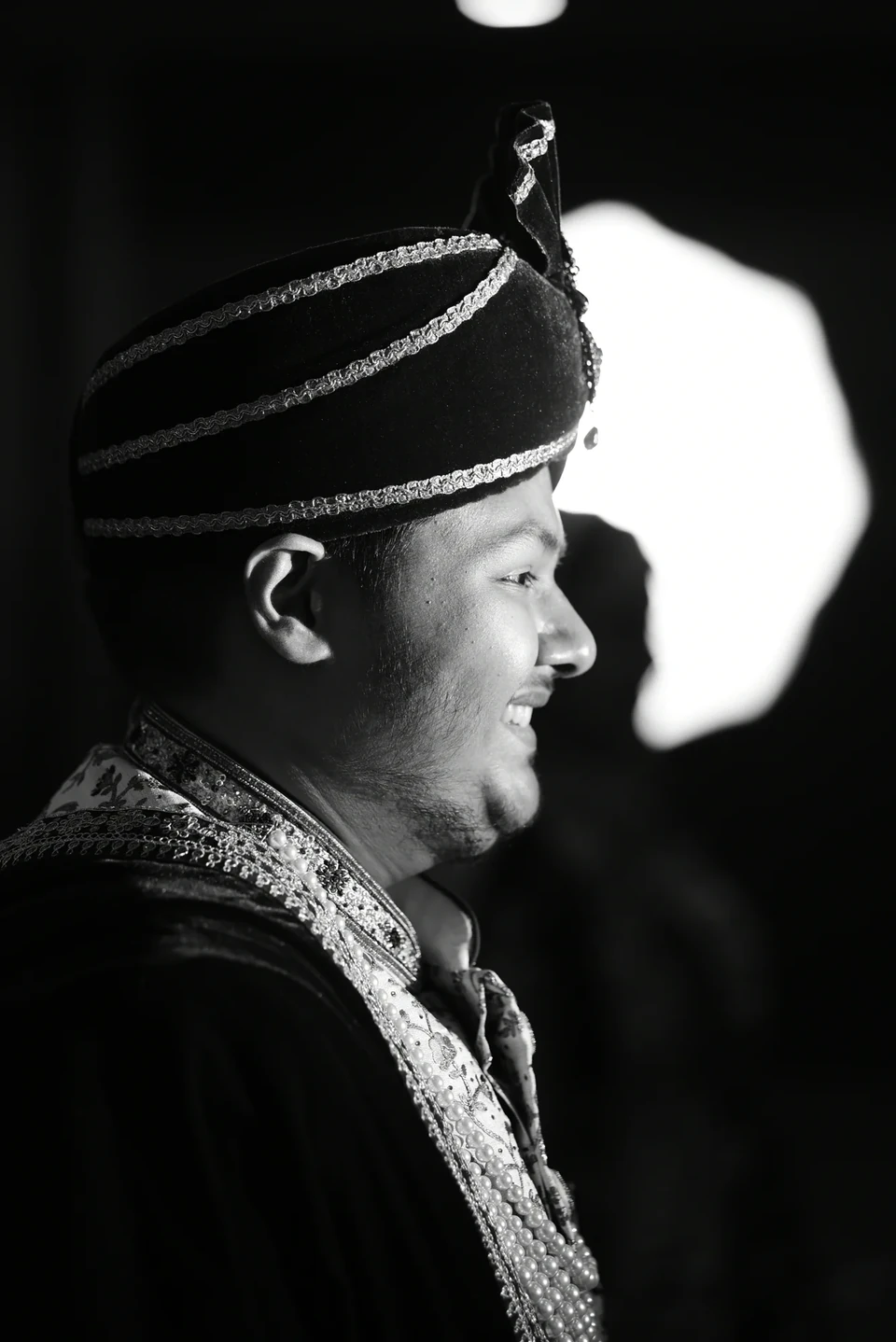Dramatic monochrome portrait of a groom